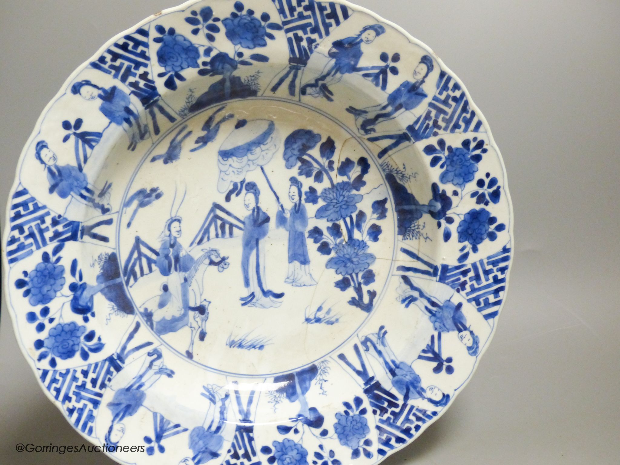 A Chinese blue and white dish, Kangxi mark and of the period, diameter 34cm, and a 19th century Chinese blue and white jar